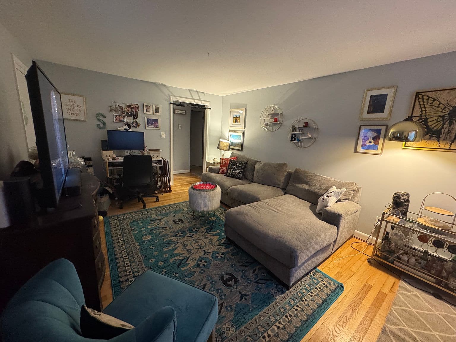 Hallway with hardwood floors in the first-floor apartment on Manchester Cir in West Hartford.